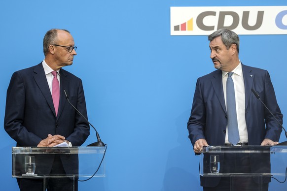 German opposition leader and Christian Democratic Union party chairman Friedrich Merz, left, and Markus Soeder, Christian Social Union party leader and state governor of Bavaria, attend a joint news c ...