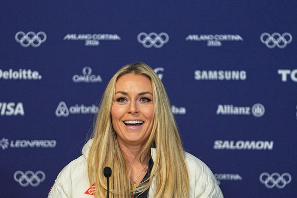 United States' Lindsey Vonn smiles as she arrives for a press conference by the U.S. ski team at the 2026 Winter Olympics, in Cortina d'Ampezzo, Italy, Tuesday, Feb. 3, 2026. (AP Photo/Fatim ...
