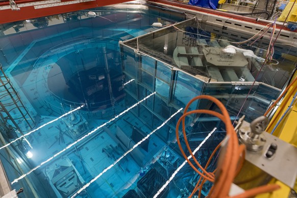 epa09562874 (FILE) - View of the open reactor (L), the disassembly basin (R) and the baskets with parts of the disassembled steam dryer in the reactor internal storage pool of the nuclear power plant ...