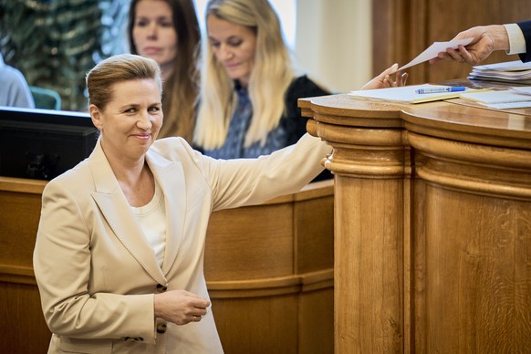 epaselect epa12778149 Danish Prime Minister Mette Frederiksen attends a session during which she announced early parliamentary election in the Parliament Hall at Christiansborg in Copenhagen, Denmark, ...