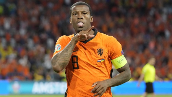 Georginio Wijnaldum of the Netherlands celebrates after scoring his side&#039;s opening goal during the Euro 2020 soccer championship group C match between the Netherlands and Ukraine at the Johan Cru ...