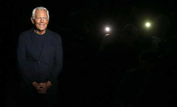 epa08125420 Italian fashion designer Giorgio Armani appears on the runway after the show by his label during the Milan Fashion Week Men&#039;s, in Milan, Italy, 13 January 2020. The Fall-Winter 2020/2 ...