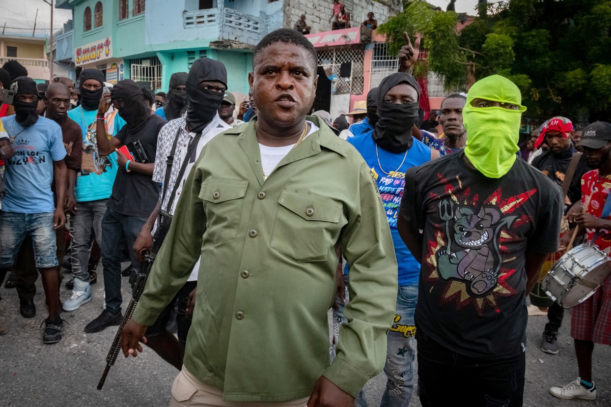 epa10870899 The head of the powerful Haitian armed gang G9 Jimmy Cherisier (C), alias Barbecue, led a demonstration attended by several hundred people calling for the removal of Prime Minister Ariel H ...