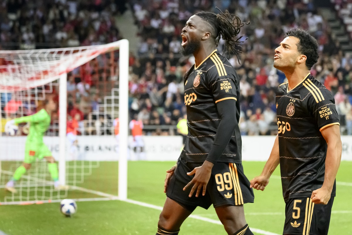 Ajax's Toluwalase Arokodare, CENTER, celebrates his 2 - 3 goal with Ajax's Owen Wijndal, right, during the first leg of the UEFA Conference League play-off round round soccer match between S ...