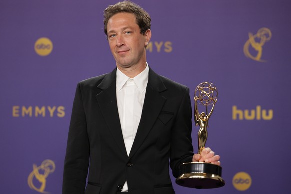 epa11607166 Ebon Moss-Bachrach, winner of the Best Supporting Actor in a Comedy Series award, poses in the press room during the 76th annual Emmy Awards ceremony held at the Peacock Theater in Los Ang ...