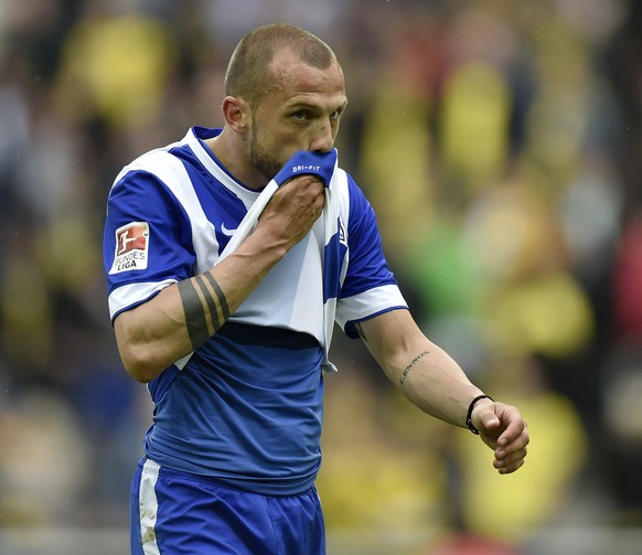 Berlin&#039;s John Heitinga from the Netherlands leaves the pitch disappointed after losing the German first division Bundesliga soccer match between Borussia Dortmund and Hertha BSC Berlin in Dortmun ...