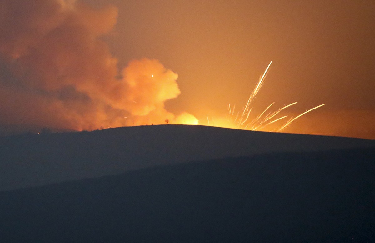 Explosions are seen in the mountains during fighting between Armenian and Azerbaijan's forces during a military conflict outside Stepanakert, the separatist region of Nagorno-Karabakh, Sunday, No ...