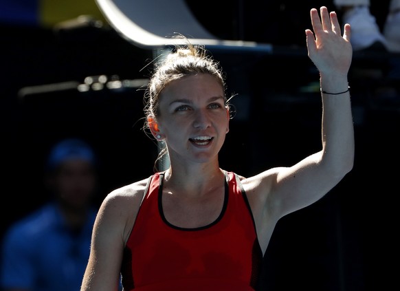 Romania&#039;s Simona Halep celebrates after defeating Karolina Pliskova of the Czech Republic in their quarterfinal at the Australian Open tennis championships in Melbourne, Australia, Wednesday, Jan ...