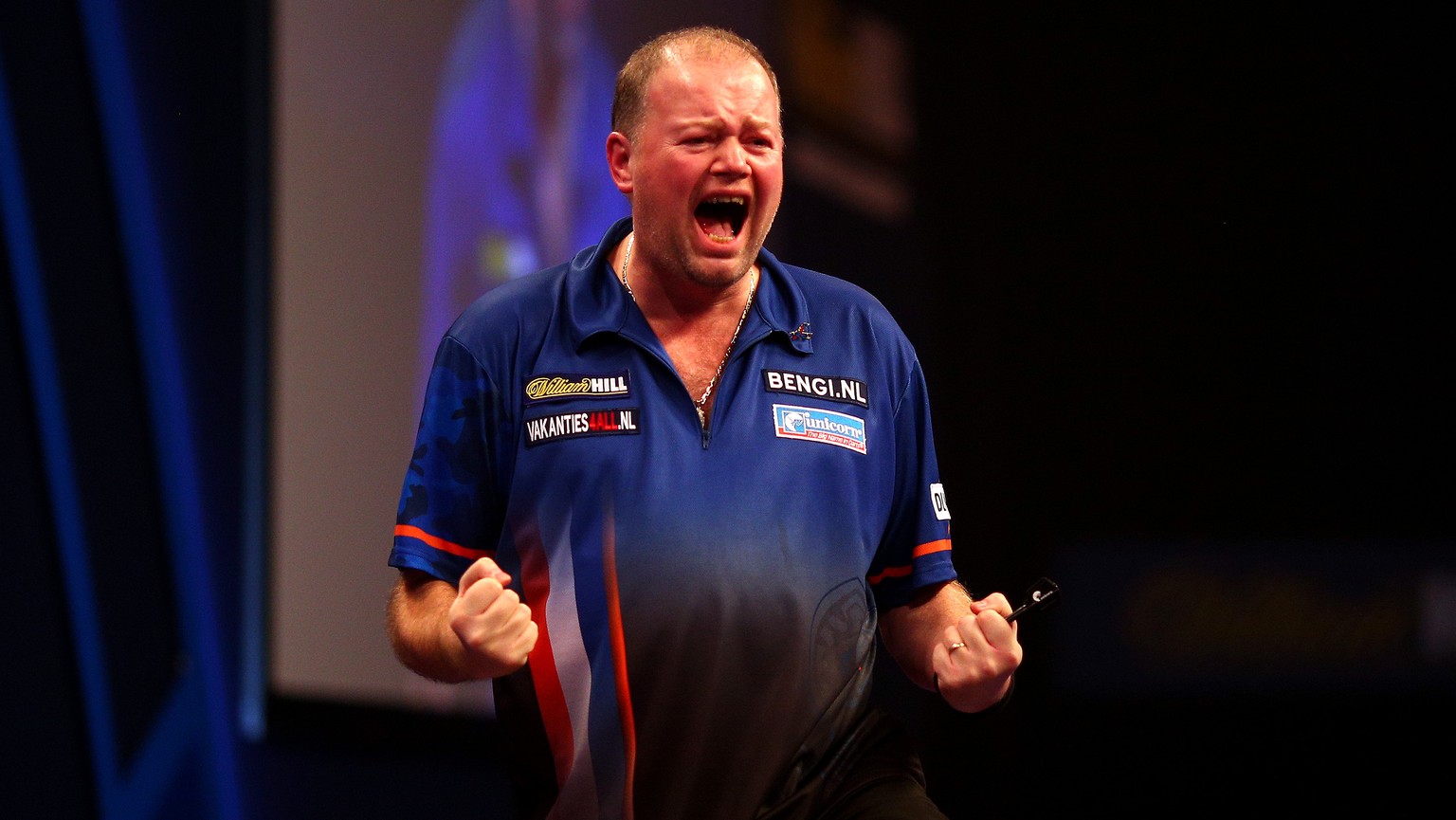 LONDON, ENGLAND - DECEMBER 30: Raymond van Barneveld of Holland celebrates winning his third round match against Adrian Lewis of England during the William Hill PDC World Darts Championships on Day Te ...