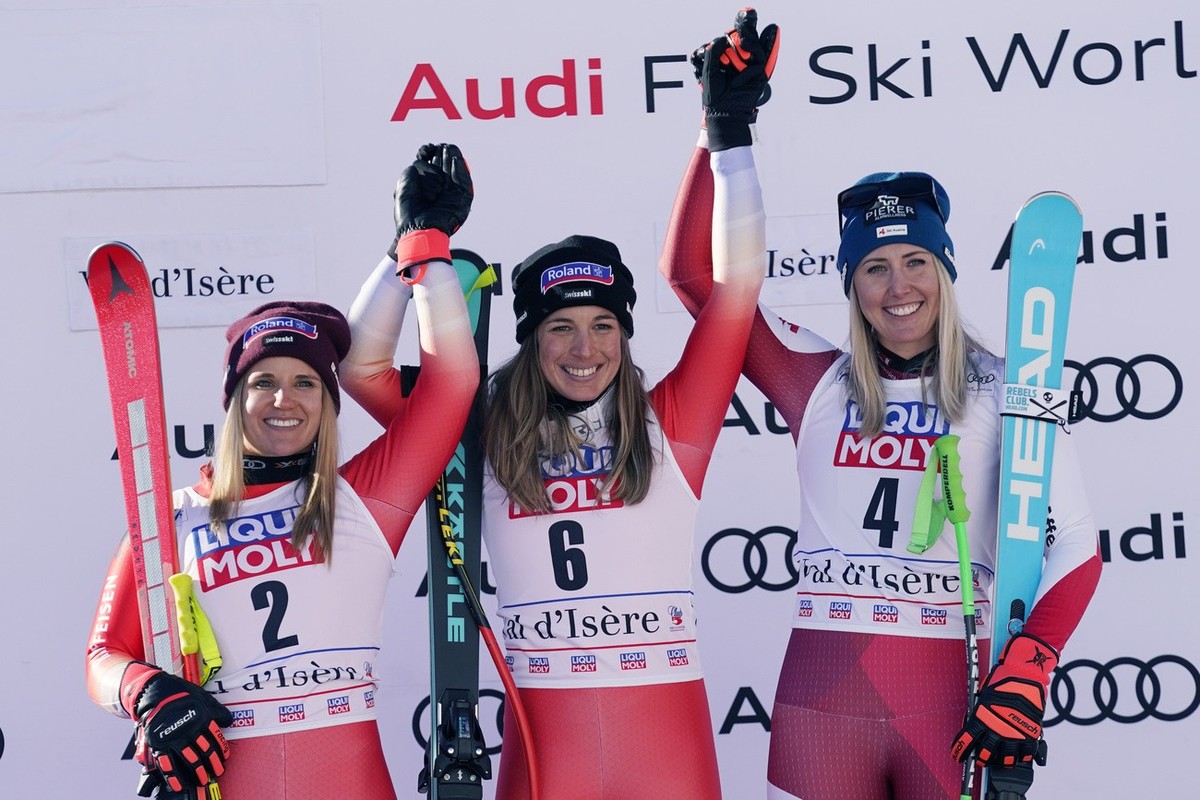 From left, second placed Switzerland's Joana Haehlen, the winner Switzerland's Jasmine Flury and third placed Austria's Cornelia Huetter celebrate after an alpine ski, women's Worl ...