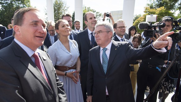 International Olympic Committee (IOC) president Thomas Bach from Germany, right, speaks with Sweden&#039;s Crown Princess Victoria, center, and Swedish Prime Minister Stefan Lofven, left, before a bil ...