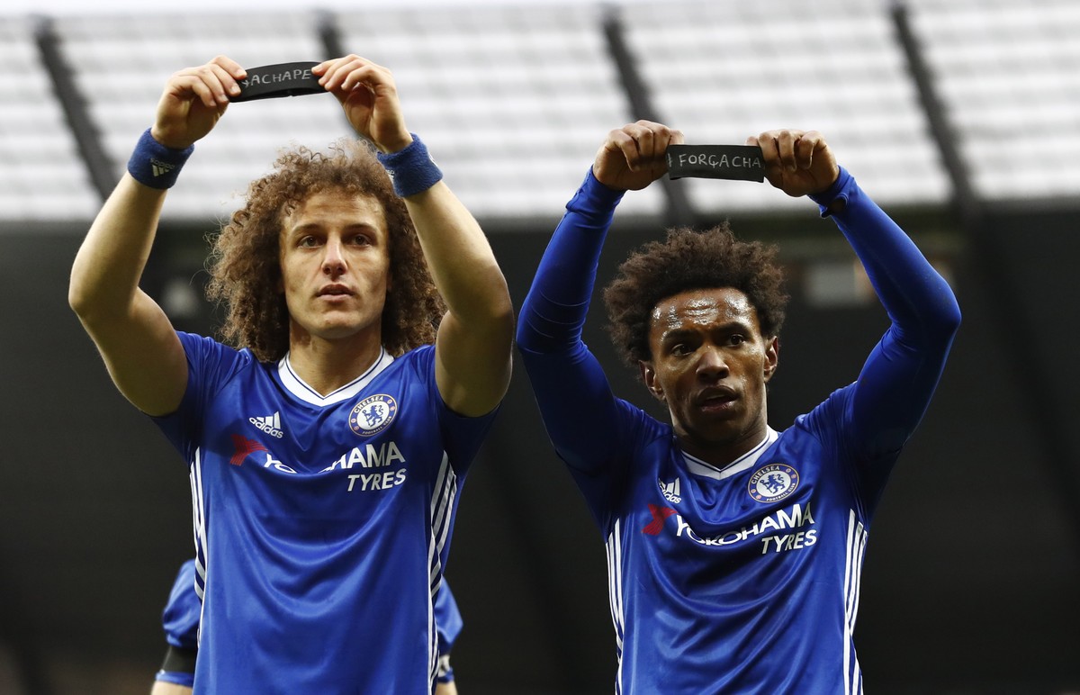 Britain Football Soccer - Manchester City v Chelsea - Premier League - Etihad Stadium - 3/12/16 Chelsea's Willian celebrates scoring their second goal with David Luiz as they hold armbands in res ...