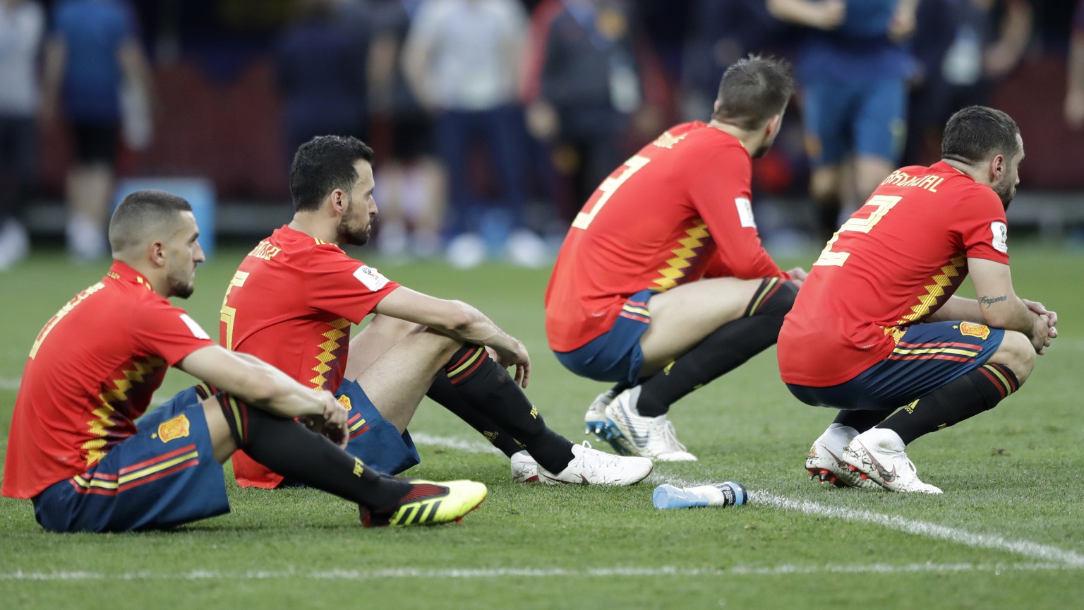 Spanish players react after there team was eliminated during the round of 16 match between Spain and Russia at the 2018 soccer World Cup at the Luzhniki Stadium in Moscow, Russia, Sunday, July 1, 2018 ...