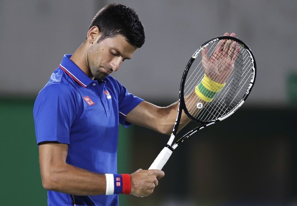 Novak Djokovic, of Serbia, compliments Juan Martin del Potro, of Argentina, on his return at the 2016 Summer Olympics in Rio de Janeiro, Brazil, Sunday, Aug. 7, 2016. (AP Photo/Charles Krupa)