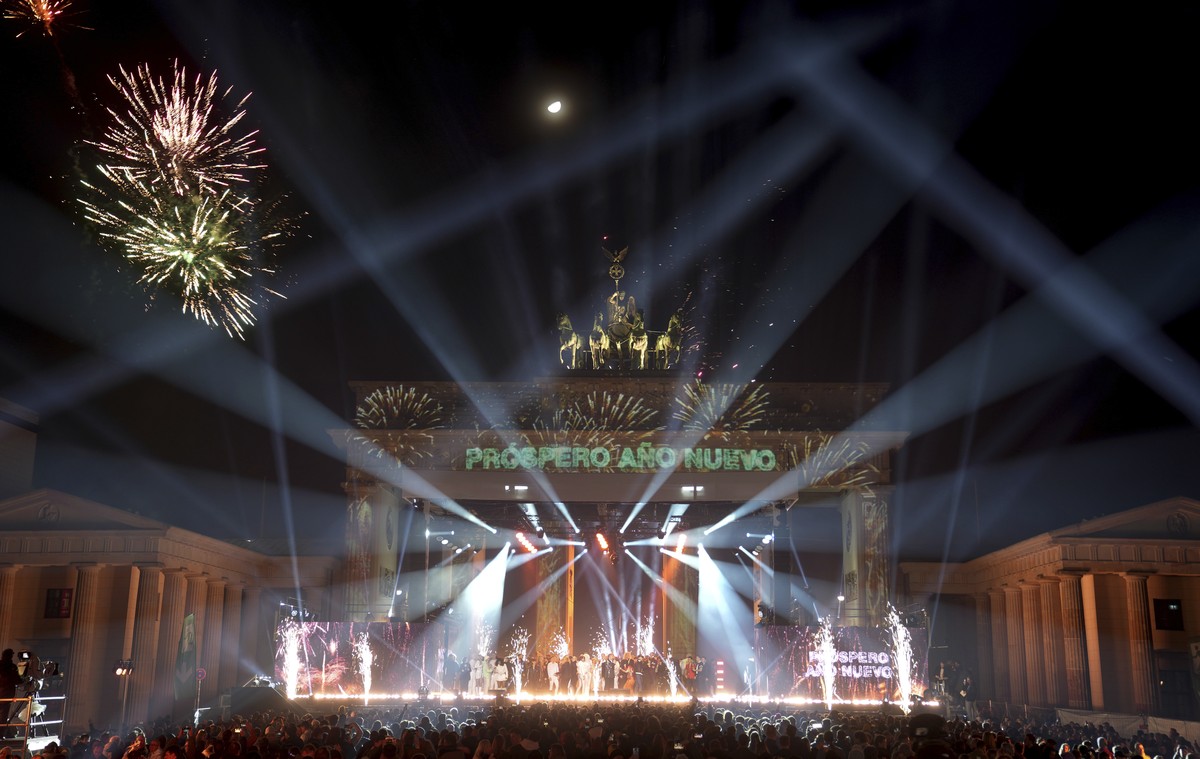 Berlin's famous landmark Brandenburg Gate is illuminated during the New Year's celebrations in Berlin, early Sunday, Jan. 1, 2023. (AP Photo/Michael Sohn)