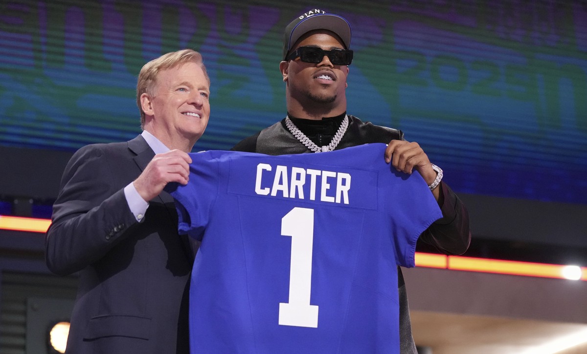 Penn State defensive end Abdul Carter, right, poses with NFL Commissioner Roger Goodell after being chosen by the New York Giants with the third overall pick during the first round of the NFL football ...