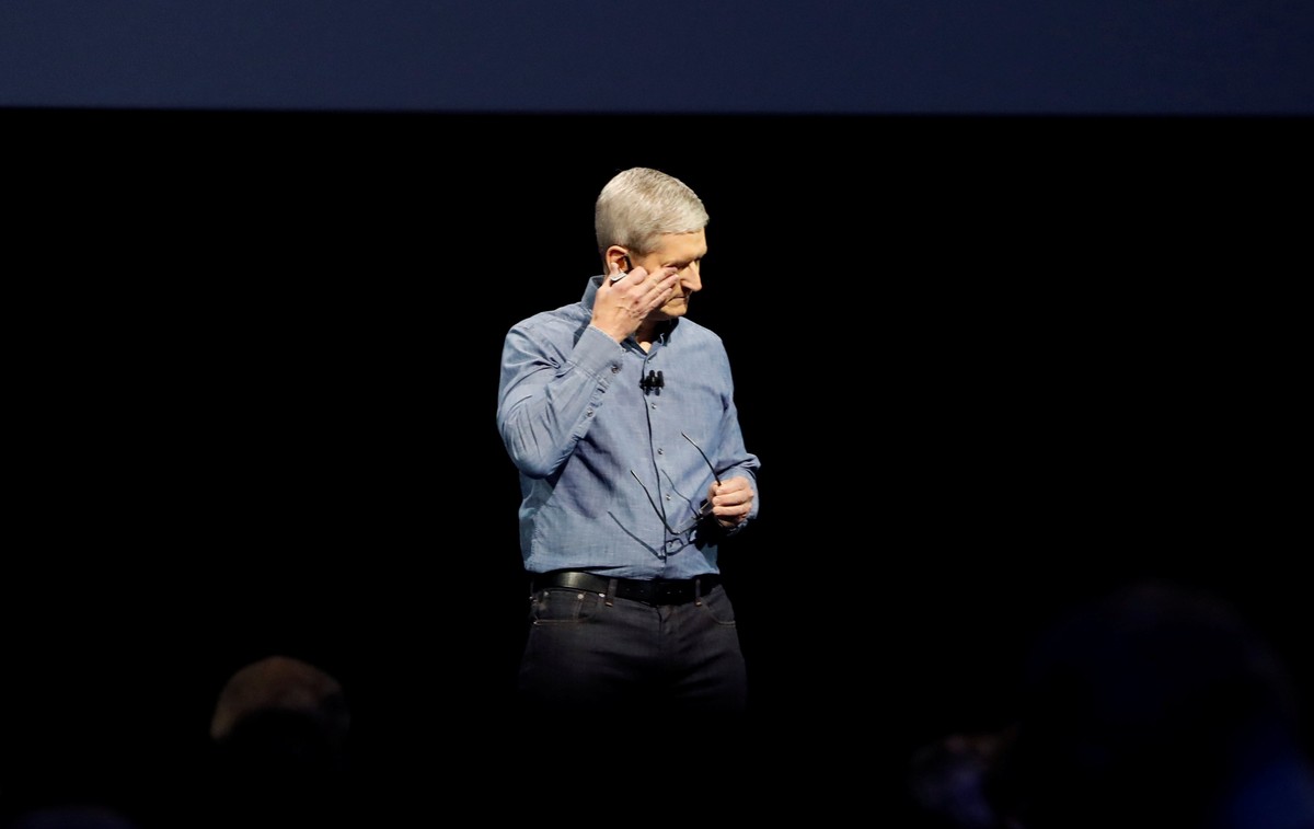 Apple Inc. CEO Tim Cook wipes his eyes after leading a moment of silence for the victims of the attack in Orlando as he opens the company's World Wide Developers Conference in San Francisco, Cali ...