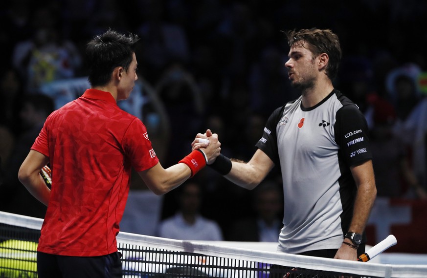 Britain Tennis - Barclays ATP World Tour Finals - O2 Arena, London - 14/11/16 Japan&#039;s Kei Nishikori shakes hands with Switzerland&#039;s Stanislas Wawrinka after winning their round robin match R ...