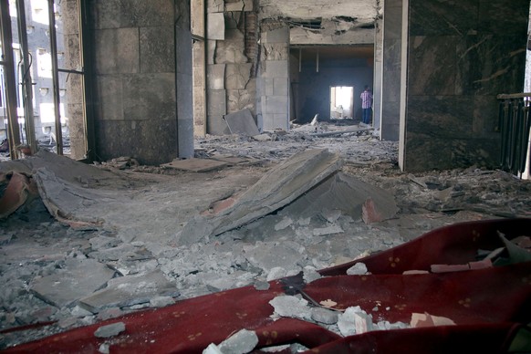 REFILE - ADDING RESTRICTION A man walks inside the destroyed parliament building in Ankara, July 16, 2016 after an attempted coup in Turkey. REUTERS/Stringer FOR EDITORIAL USE ONLY. NO RESALES. NO ARC ...