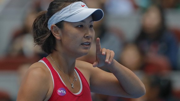 Chinese tennis player Peng Shuai reacts during her women&#039;s singles match at the China Open tennis tournament in Beijing on Oct. 5, 2016. When Peng disappeared from public view this month after ac ...