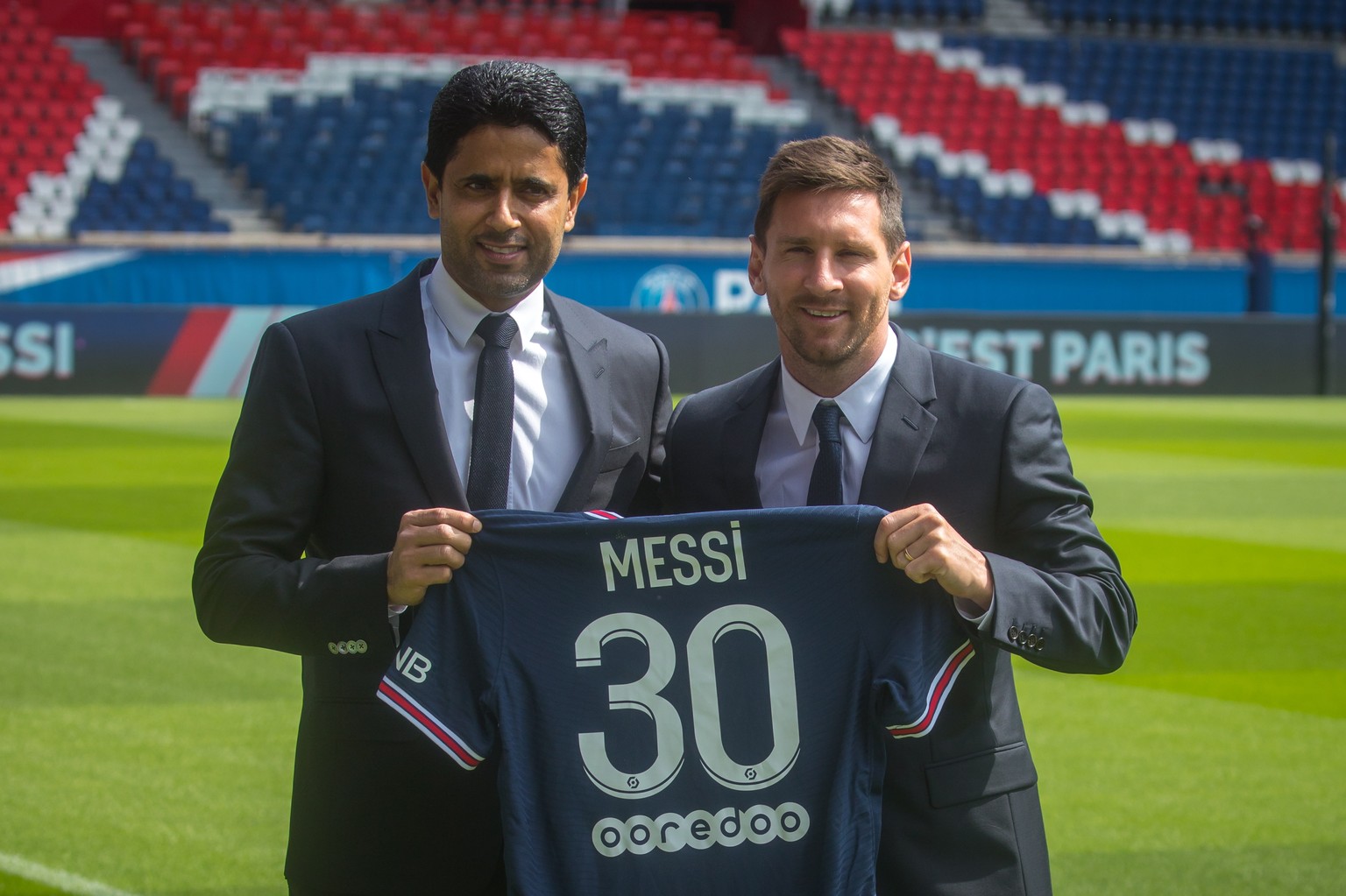 epa09409578 Paris Saint-Germain&#039;s president Nasser Al-Khelaifi (L) and Argentinian striker Lionel Messi pose with his new PSG jersey after his press conference as part of his official presentatio ...