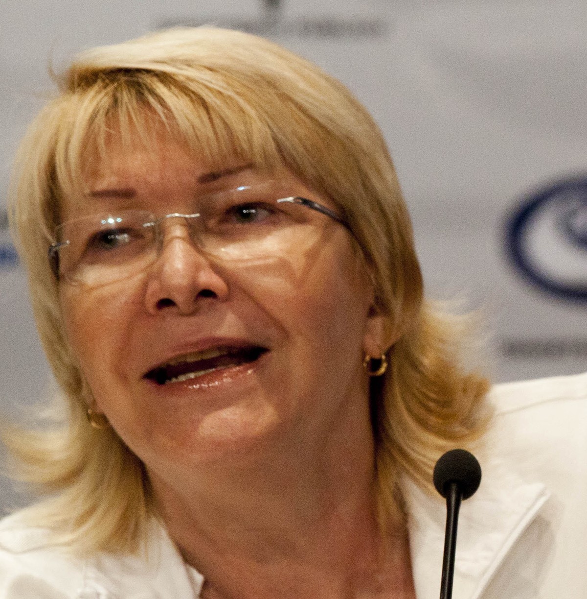 FILE - In this Oct. 21, 2013, file photo, Venezuela's Attorney General Luisa Ortega Diaz holds up an image showing evidence recovered from the small plane YV2615 that crashed in January in the Lo ...
