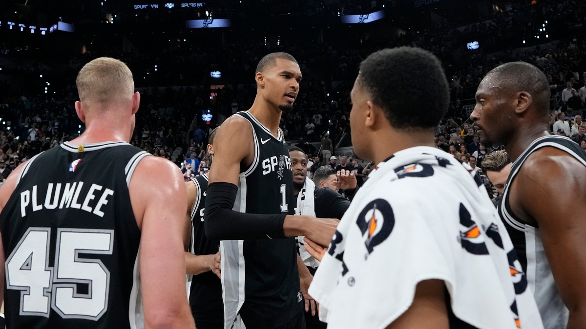 San Antonio Spurs forward Victor Wembanyama (1) speaks to reammates after a win over the Oklahoma City Thunder after Game 6 in the Western Conference finals NBA basketball playoffs series, Thursday, M ...