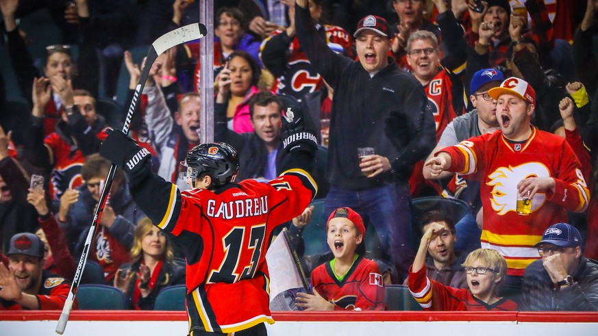 Dec 4, 2016; Calgary, Alberta, CAN; Calgary Flames left wing Johnny Gaudreau (13) celebrates his goal in front of fans during the first period against the Anaheim Ducks at Scotiabank Saddledome. Manda ...