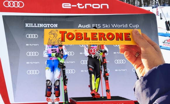 KILLINGTON, VT - NOVEMBER 25: (L-R) Petra Vlhova of Slovakia in 2 place, Mikaela Shiffrin of the US in 1st place and Frida Hansdotter of Sweden in 3rd celebrate on the podium on November 25, 2018