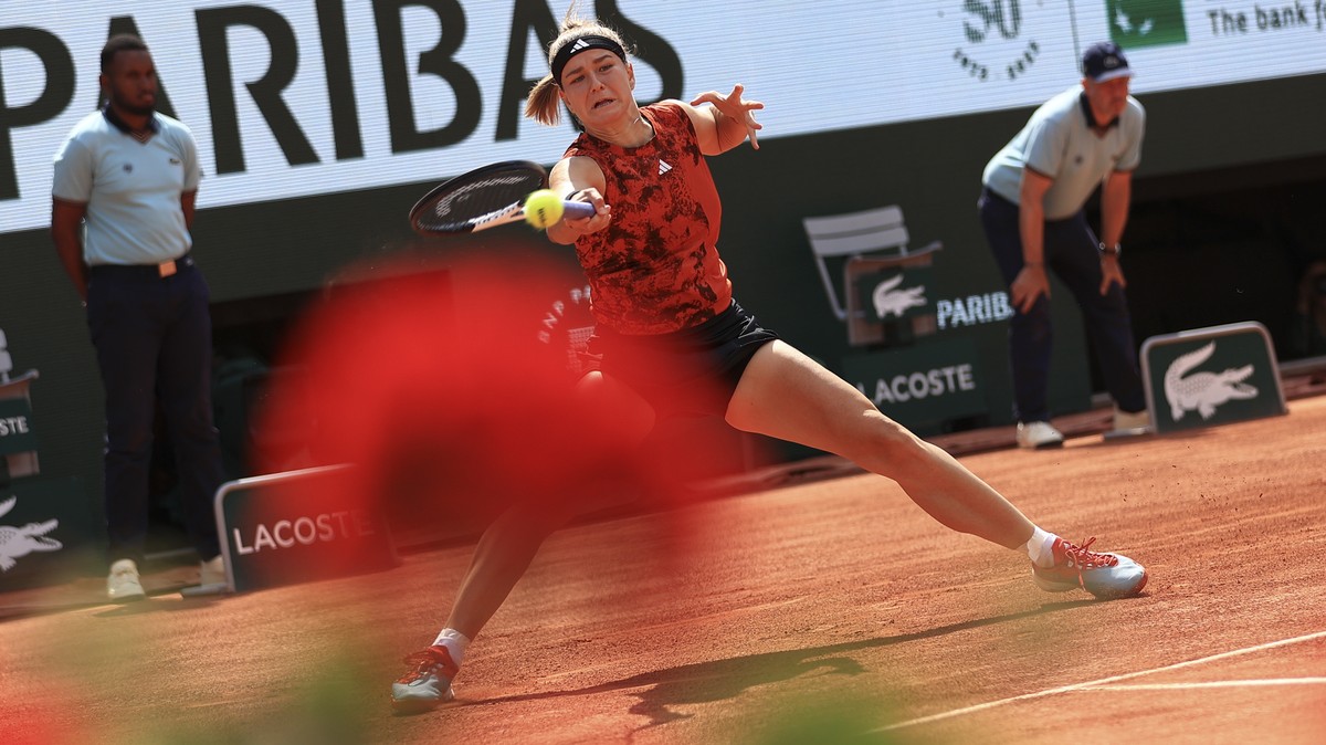 Karolina Muchova of the Czech Republic plays a shot against Poland's Iga Swiatek during the women's final match of the French Open tennis tournament at the Roland Garros stadium in Paris, Sa ...