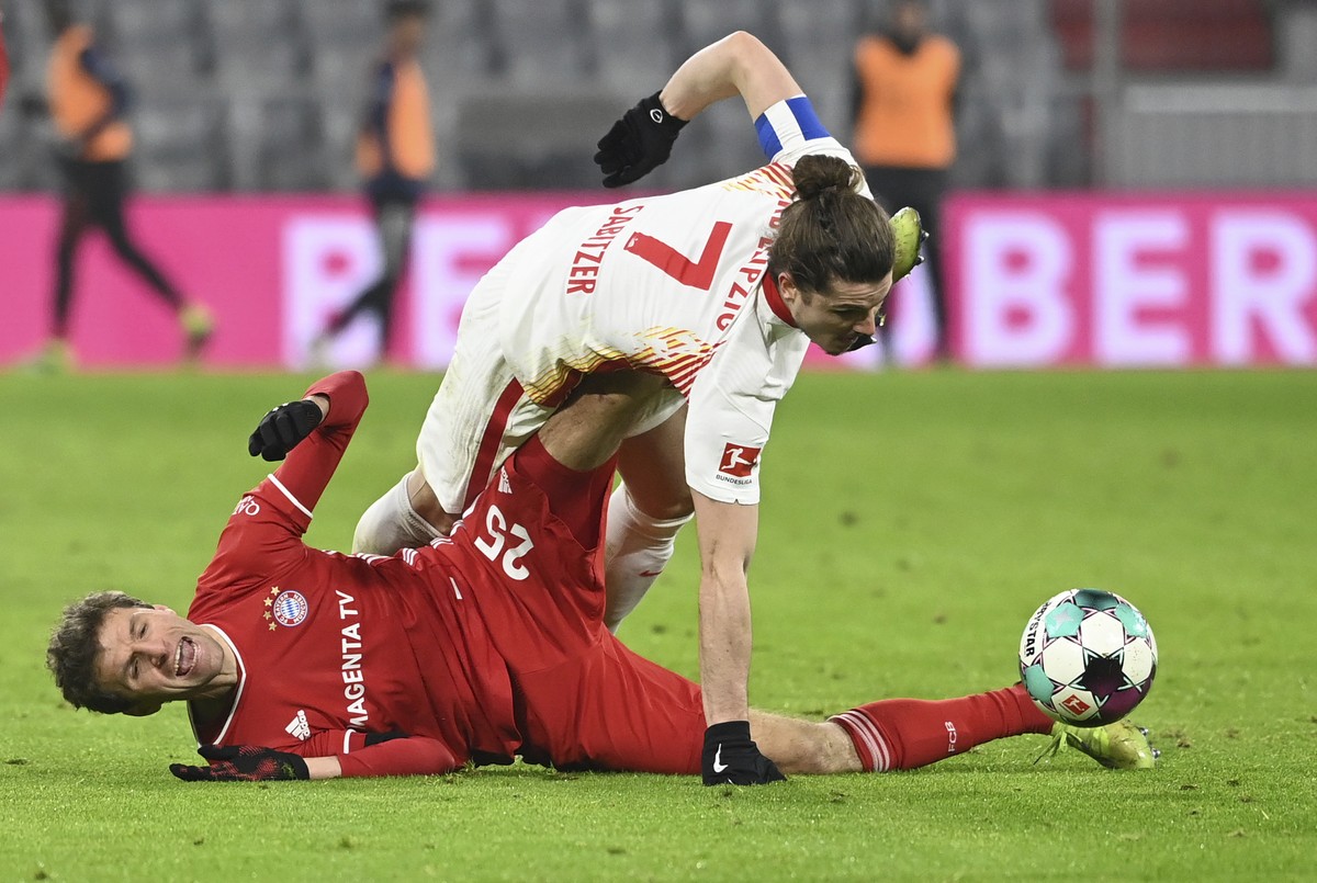 Leipzig's Marcel Sabitzer (7) and Bayern's Thomas Muller compete for the ball during a German Bundesliga soccer match between Bayern Munich and RB Leipzig in Munich, Germany, Saturday, Dec.  ...