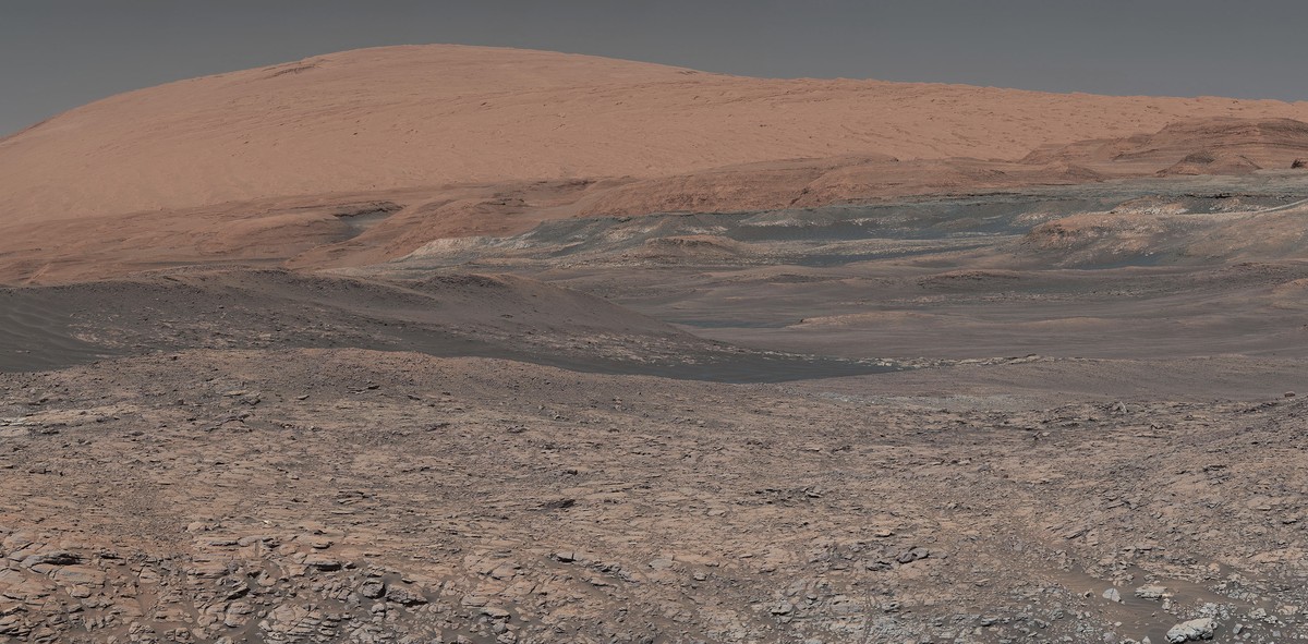 This image provided by NASA, assembled from a series of January 2018 photos made by the Mars Curiosity rover, shows an uphill view of Mount Sharp, which Curiosity has been climbing. Spanning the cente ...
