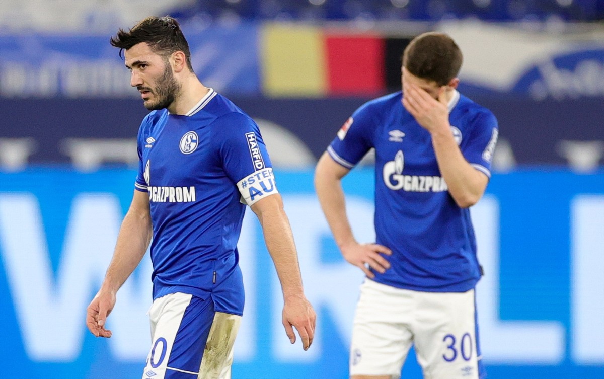 epa09086848 Schalke's Sead Kolasinac (L) reacts after losing the German Bundesliga soccer match between FC Schalke 04 and Borussia Moenchengladbach in Gelsenkirchen, Germany, 20 March 2021. EPA/F ...