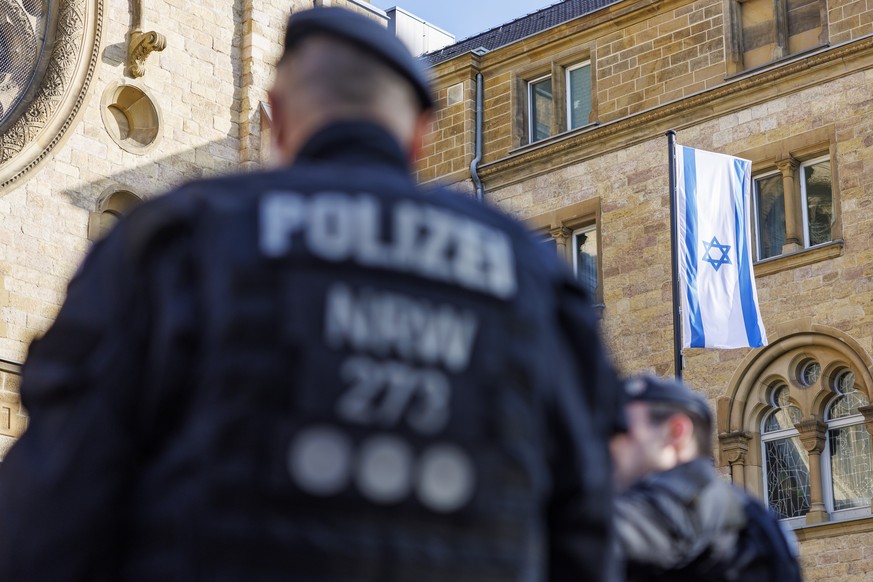 epa10969817 The synagogue is specially guarded by the police during the carnival in Cologne, Germany, 11 November 2023. The German carnival, the so-called fifth season, starts each year on 11 November ...