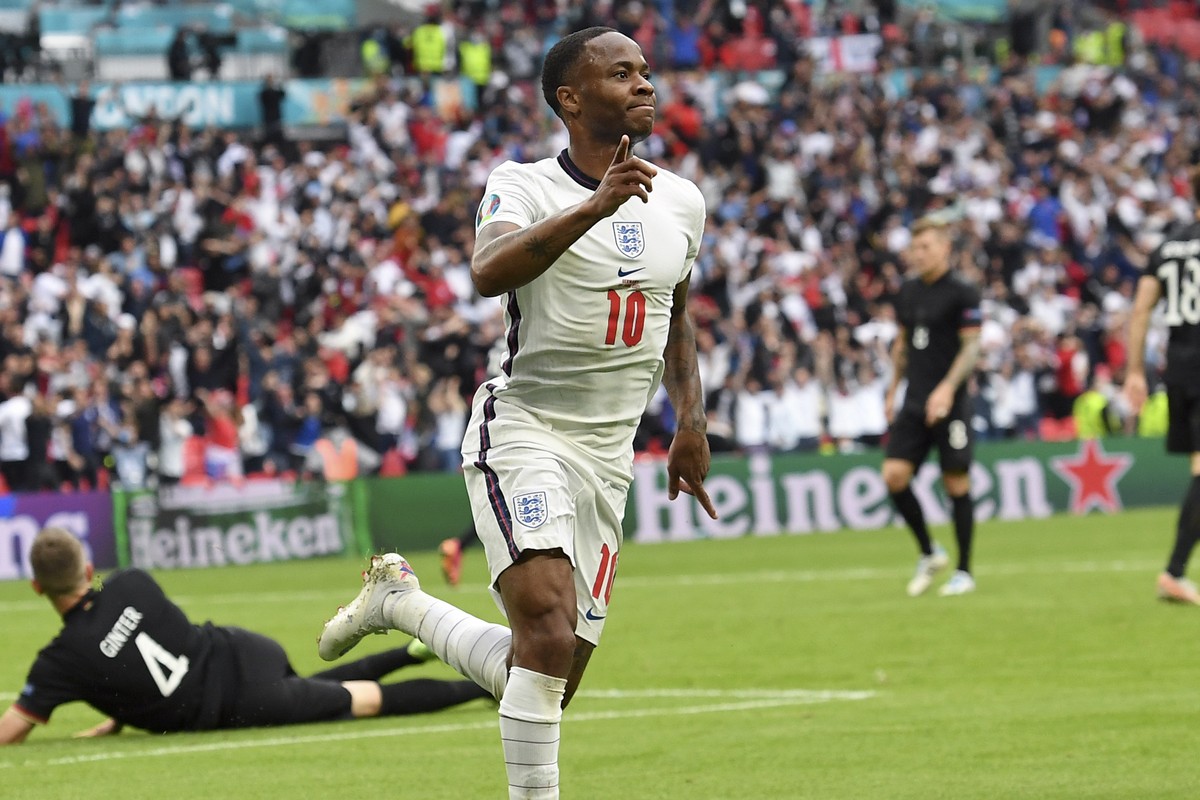 England's Raheem Sterling celebrates after scoring his side's opening goal during the Euro 2020 soccer championship round of 16 match between England and Germany, at Wembley stadium in Londo ...