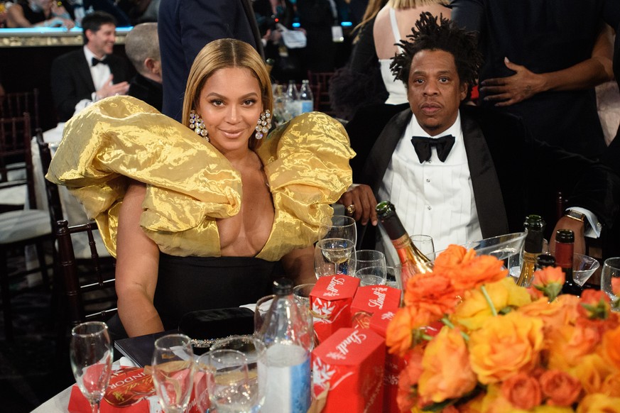 epa08106838 A handout photo made available by the Hollywood Foreign Press Association (HFPA) shows Beyonce Knowles-Carter and Jay-Z during the 77th annual Golden Globe Awards ceremony at the Beverly H ...