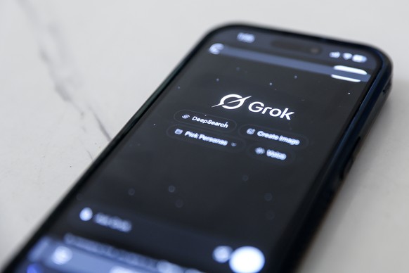 epa12644241 The Grok artificial intelligence (AI) website is displayed on a mobile phone as a nationwide restriction on the service takes effect, in Shah Alam, outside Kuala Lumpur, Malaysia 12 Januar ...