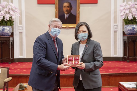 In this photo released by the Taiwan Presidential Office, Sen. Lindsey Graham, R-S.C., left, and Taiwan&#039;s President Tsai Ing-wen, right, pose for a photo during a meeting at the Presidential Offi ...