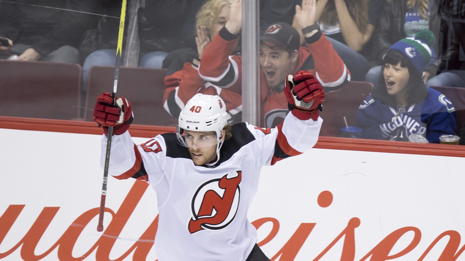 New Jersey Devils&#039; Blake Coleman celebrates a goal by Jimmy Hayes against the Vancouver Canucks during the second period of an NHL hockey game in Vancouver, British Columbia, Wednesday, Nov. 1, 2 ...