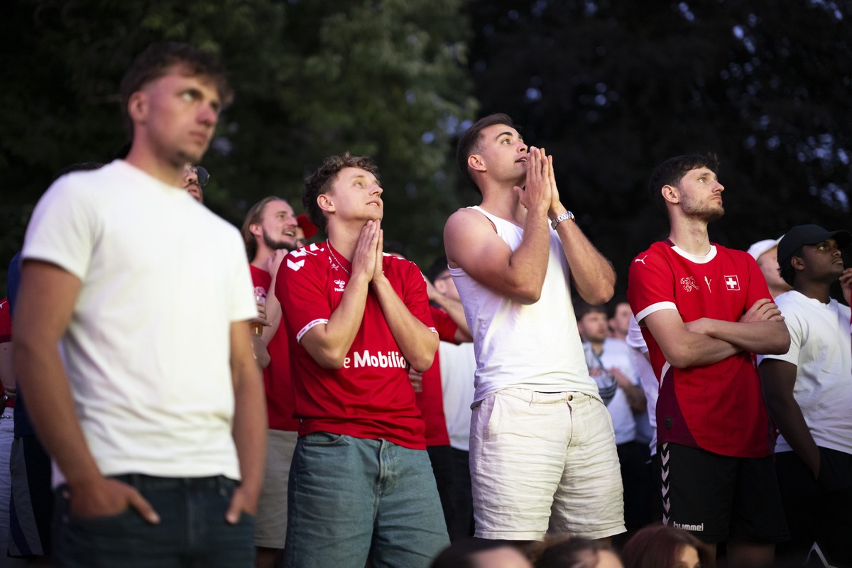 Swiss fans react in extra time in the 2026 FIFA World Cup quarterfinal match between Switzerland and Argentina, which kicked off at 3 a.m., during a public viewing event at the Museumsquartier in fron ...