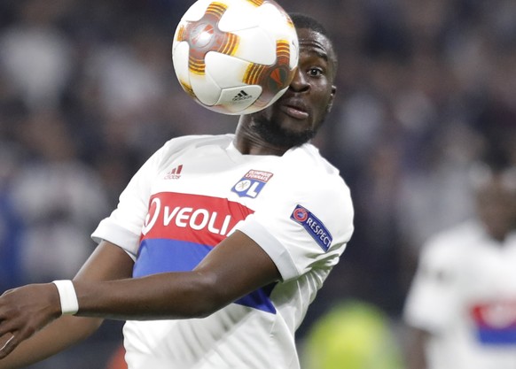 Lyon's Tanguy Ndombele heads the ball during the Europa League Group E soccer match between Lyon and Everton at the Lyon stadium in Decines, near Lyon, France, Thursday, Nov. 2, 2017. (AP Photo/Lauren ...