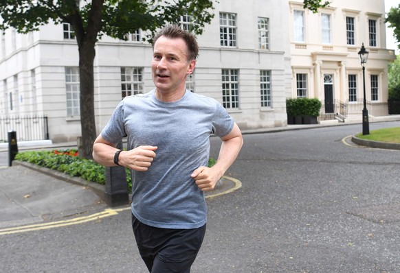 epa07732803 Britain&#039;s Foreign Secretary Jeremy Hunt jogging near his official residence in London, Britain, 22 July 2019. Hunt and his Conservative Leadership rival Boris Johnson will discover wh ...