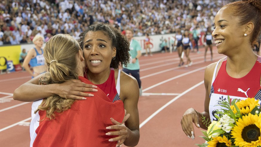 Mujinga Kambundji, left, and Salome Kora from Switzerland, right, react after the women&#039;s 4x100m Zurich trophy race, during the Weltklasse IAAF Diamond League international athletics meeting in t ...