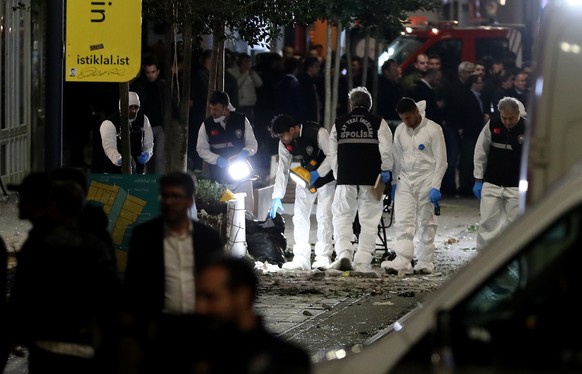 epa10303952 The crime scene investigation team works as Turkish policemen try to secure the area after an explosion at Istiklal Street in Istanbul, Turkey, 13 November 2022. According to governor Ali  ...