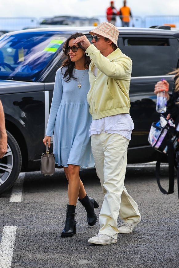 NORTHAMPTON, ENGLAND - JULY 7: Brad Pitt, star of upcoming &#039;F1&#039; movie, arrives in the paddock with girlfriend Ines de Ramon during the F1 Grand Prix of Great Britain at Silverstone Circuit o ...