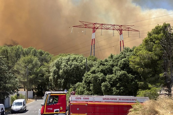 This photo provided by the fire brigade SDIS13, smoke rises during a wildfire near Marseille, southern France, Tuesday, July 8, 2025. (SDIS13 via AP)
France Wildfire