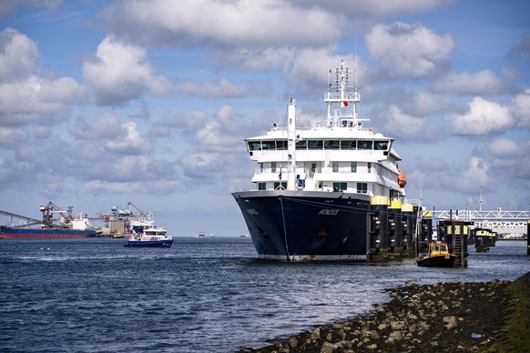 epa12970207 Hantavirus-hit cruise ship MV Hondius arrives in the port of Rotterdam, The Netherlands, 18 May 2026. The cruise ship is due to dock in Rotterdam with 27 people still on board, including D ...