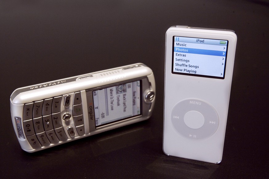 SAN FRANCISCO - SEPTEMBER 7: The new iPod cell phone and iPod nano are shown during an Apple press event where Apple CEO Steve Jobs introduced the new iPod cell phone, made by Motorola, and the new iP ...