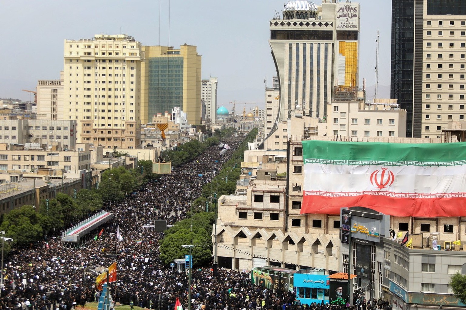 epa11363155 A handout photo made available by the Iranian presidency shows, Iranians take part in late president Ebrahim Raisi funeral ceremony in Mashhad, Iran, 23 May 2024. Iranian president Raisi a ...