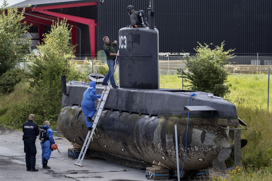 FILE - This is a Sunday, Aug. 13, 2017, file photo of police technicians board Peter Madsen&#039;s submarine UC3 Nautilus on a pier in Copenhagen harbour, Denmark. A Danish prosecutor said Tuesday Jan ...